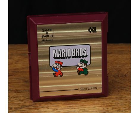 Retro Gaming &amp; Technology - a Nintendo Mario Brothers 'game and watch' multi screen device, model no.MW-56, unboxed 