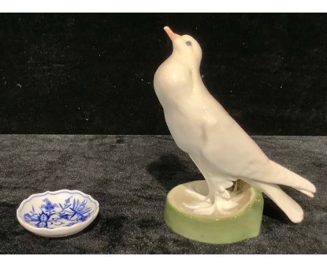 A Dresden model of a dove, standind, beak raised, circilar base, 19cm, impressed number 145, N133, painted crossed swords mar