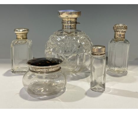 A large silver and enamel top globular cut glass scent bottle, Birmingham 1923, 12cm high; a dressing table jar, with silver 