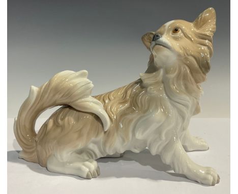 A Lladro model of a Pekingese Dog, impressed and blue printed mark to underside of base, 21cm high 