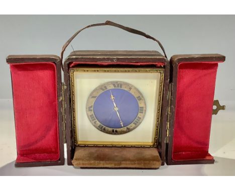 An early 20th century travelling timepiece, blue guilloche enamel dial, Roman numerals on gilt metal chapter ring, easel stan