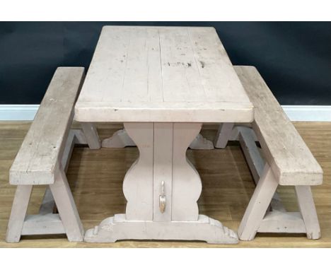 A rectangular painted pine farmhouse kitchen table and two benches, the table 78.5cm high, 149cm wide, 75cm deep, the benches