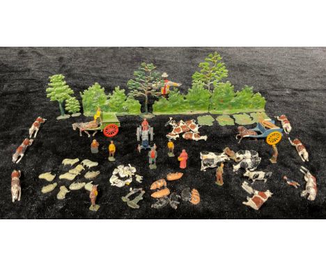 A set of miniature cold painted lead farm animals, figures and tractor, wagons, scarecrow, , shrubs and trees 
