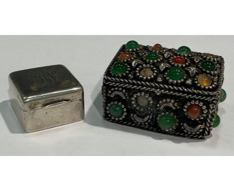 A silver coloured metal stamp case; an Indian silver coloured metal bejewelled box (2) 