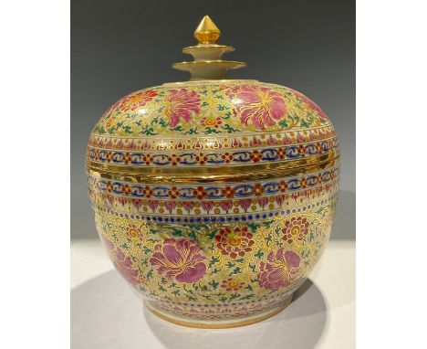An Indonesian ovoid jar and domed cover, spire finial, printed and painted with pink and red flowerheads, picked out in gilt,