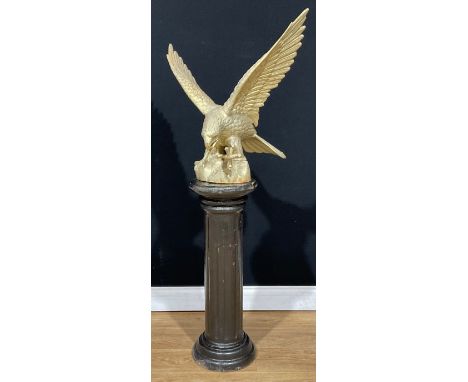 A large Japanese Meiji style cast iron model, of an eagle, 62cm high, 63cm wide; a cast iron statuary pedestal or column, 75.