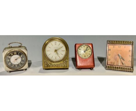 A Cyma Art Deco clock; a Europa musical alarm; an Inventic alarm; another (4) 
