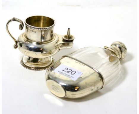 A silver mounted glass hip flask, Birmingham 1900; together with a silver table lighter 