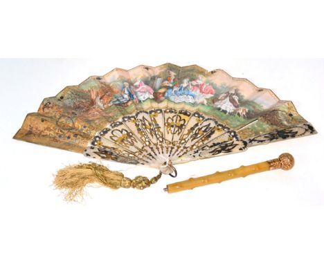 A mother of pearl fan with carved sticks and paper mount, decorated with a pastoral scene, 27cm, together with a parasol hand