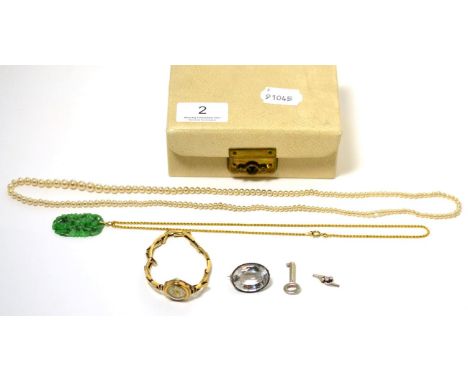 A 9 carat gold watch, a carved jade pendant on chain stamped '9CT', etc