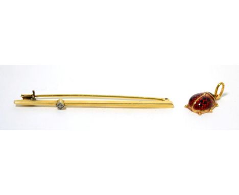 An enamel ladybird charm, stamped '750' and a diamond set bar brooch (2) 5.96g gross
