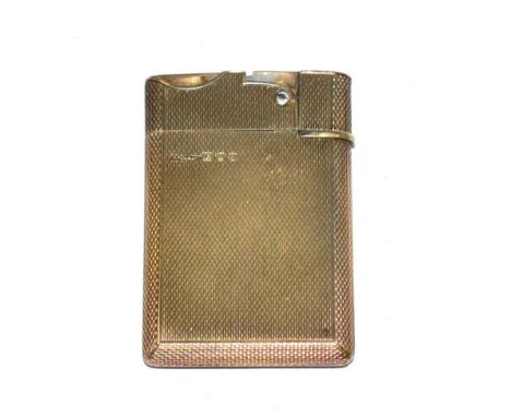 An Asprey silver gilt lighter, with engine turned engraving 