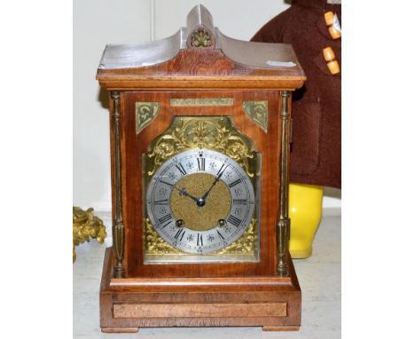 An oak cased mantel clock 