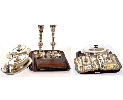 Silver and silver plated items including: five assorted serving dishes and covers, a pair of candlesticks, a boxed pair of sp