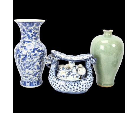 A Chinese green crackle glaze vase, height 24cm (A/F), a Chinese blue and white carp design vase, and a Chinese ceramic pillo