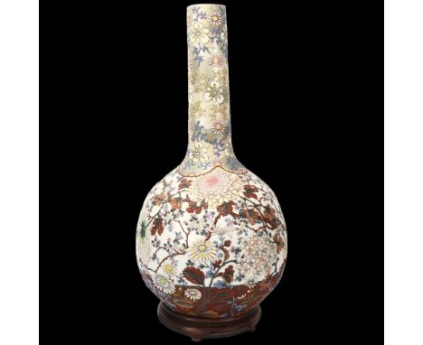 A large Japanese porcelain onion-shaped vase, circa 1900, with enamel blossom design, blossom design under base on hardwood s