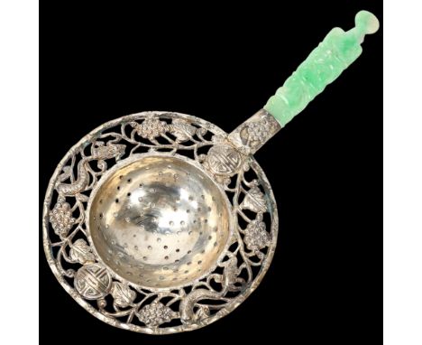 A Chinese silver tea strainer, with relief carved jade handle, length 17cm, in original fitted boxGood condition 