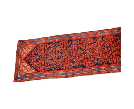 A Persian Hamadan runner, hand-made red and blue wool, 310 x 103cm 