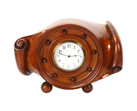 A beautifully carved aircraft propeller hub mantel clock, circa 1910, with enamel dial and 8-day movement, retailer's Wilson 
