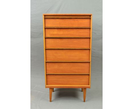 AN AUSTIN SUITE, 1960's/70's, teak chest of six long graduating drawers with rosewood veneer to handles, on four cylindrical 