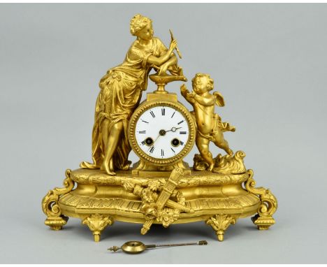 A LATE 19TH CENTURY GILT METAL FIGURAL MANTEL CLOCK, cast with lady in classical dress and a cherub either side of the circul