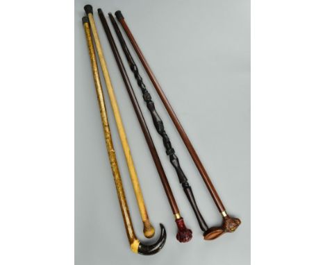 A COLLECTION OF WALKING STICKS AND CANES, including a silver mounted hound head stick, makers Comyns of London, London 2007, 