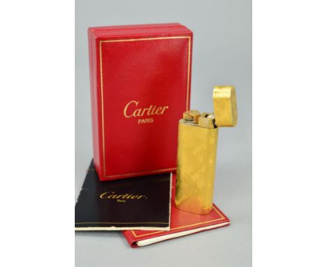 A CARTIER LIGHTER, the lighter with brushed effect finish, signed Cartier Paris, stamped 30526T, with fitted box and papers