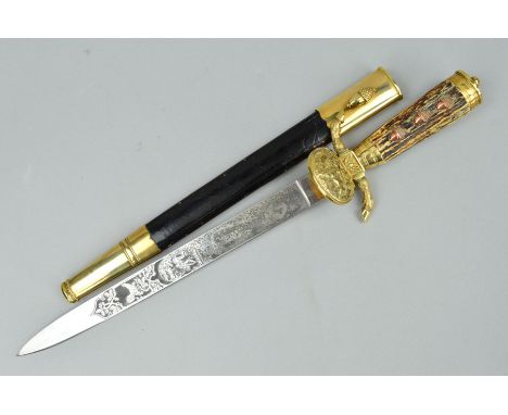 A 20TH CENTURY GERMAN HUNTING DAGGER, the blade etched to the top edge with foliate design both sides with game birds, deer s