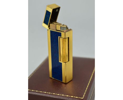 A DUNHILL LIGHTER, the lighter with engine turned decoration and a central blue enamel panel, stamped Dunhill, made in Switze