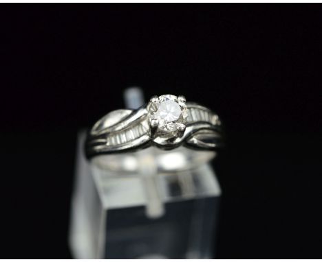 A MODERN PLATINUM DIAMOND RING, centring on a principle modern round brilliant cut diamond, measuring approximately 5.3mm in 