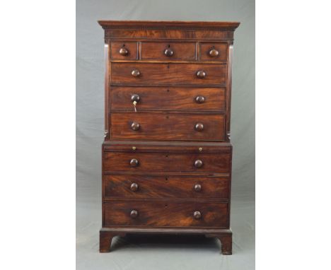 A GEORGE III MAHOGANY CHEST ON CHEST, the moulded pediment above three short and three long graduating drawers, flanked by ch
