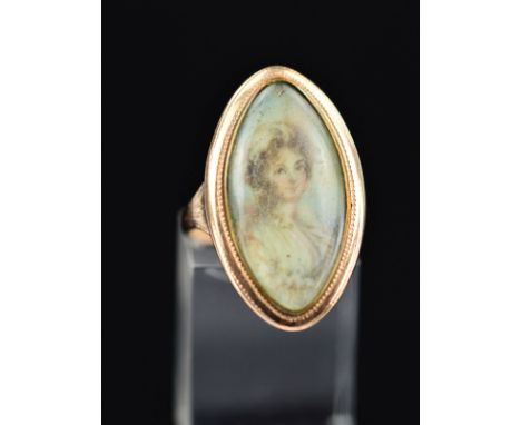 A LATE 18TH CENTURY PORTRAIT MEMORIAL RING, a navette shaped portrait depicting a lady in classical dress, closed back settin