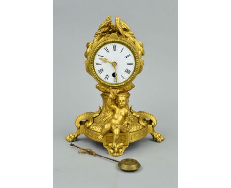 A LATE 19TH CENTURY GILT METAL MANTEL CLOCK, of balloon shape, two doves cast as surmount, enamel dial, Roman numerals, 30 ho