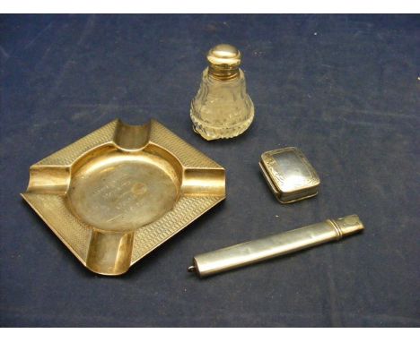 Four items of silver to include ash tray, snuff box, pencil, smelling salts bottle