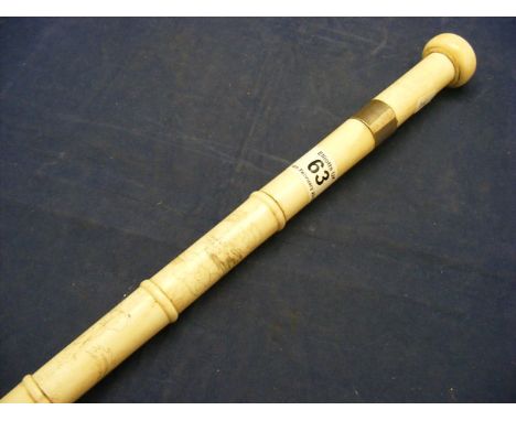 A scrimshaw walking stick with silver collar