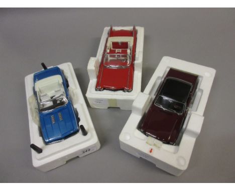 Group of three Danbury Mint collectors scale model cars, 1969 Chevrolet Camaro, 1959 Cadillac Series 62 and a 1966 Ford Musta