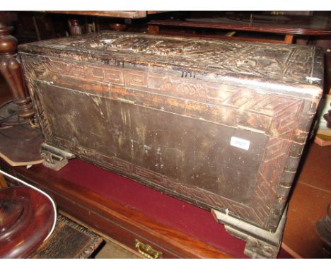Chinese camphor wood trunk having deeply carved decoration of figures and foliage (at fault)