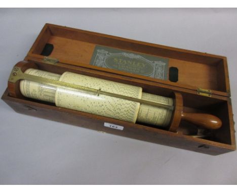 Stanley Fuller calculator in mahogany case with mounting bracket