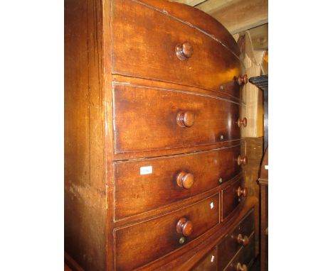 Victorian mahogany bow fronted chest of two short and three long drawers with knob handles, on bracket feet