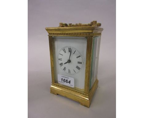 Brass cased carriage clock, the enamel dial with Roman numerals, the two train movement with hour repeat function, striking o