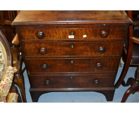 George III mahogany and crossbanded dwarf chest with a brushing slide above four graduated drawers with knob handles, raised 