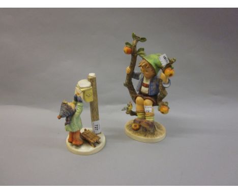 Two large Hummel figures, boy in an apple tree and boy posting a letter