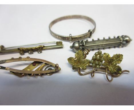 Two gold bar brooches, two other bar brooches and a silver bangle