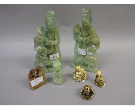 Pair of 20th Century Chinese carved jadeite figures of Immortals, together with a similar scroll weight, a pair of soapstone 