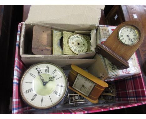 Box containing a quantity of various 20th Century clock movements, dials and a small mahogany lancet shaped clock etc.