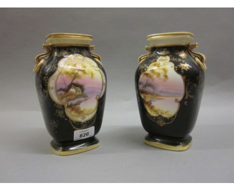 Pair of Noritake porcelain vases decorated with panels of landscapes on a dark blue ground