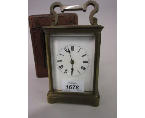 Early 20th Century gilt brass repeater carriage clock, the enamel dial with Roman numerals (at fault), with original leather 