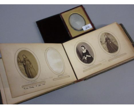 Victorian leather framed Ambrotype portrait of a gentleman, together with a Victorian photograph album