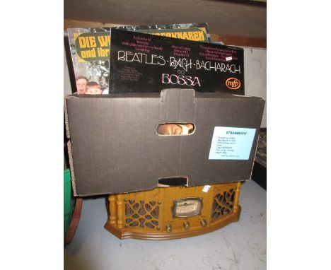 Reproduction oak cased record player together with a quantity of 33 and 78 speed records