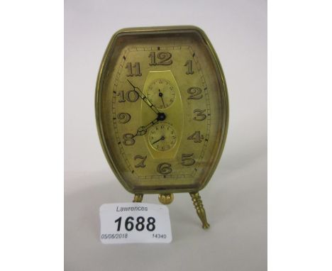 Small Longines gilt metal travel clock, the gilded dial with Arabic numerals and subsidiary seconds and alarm dials